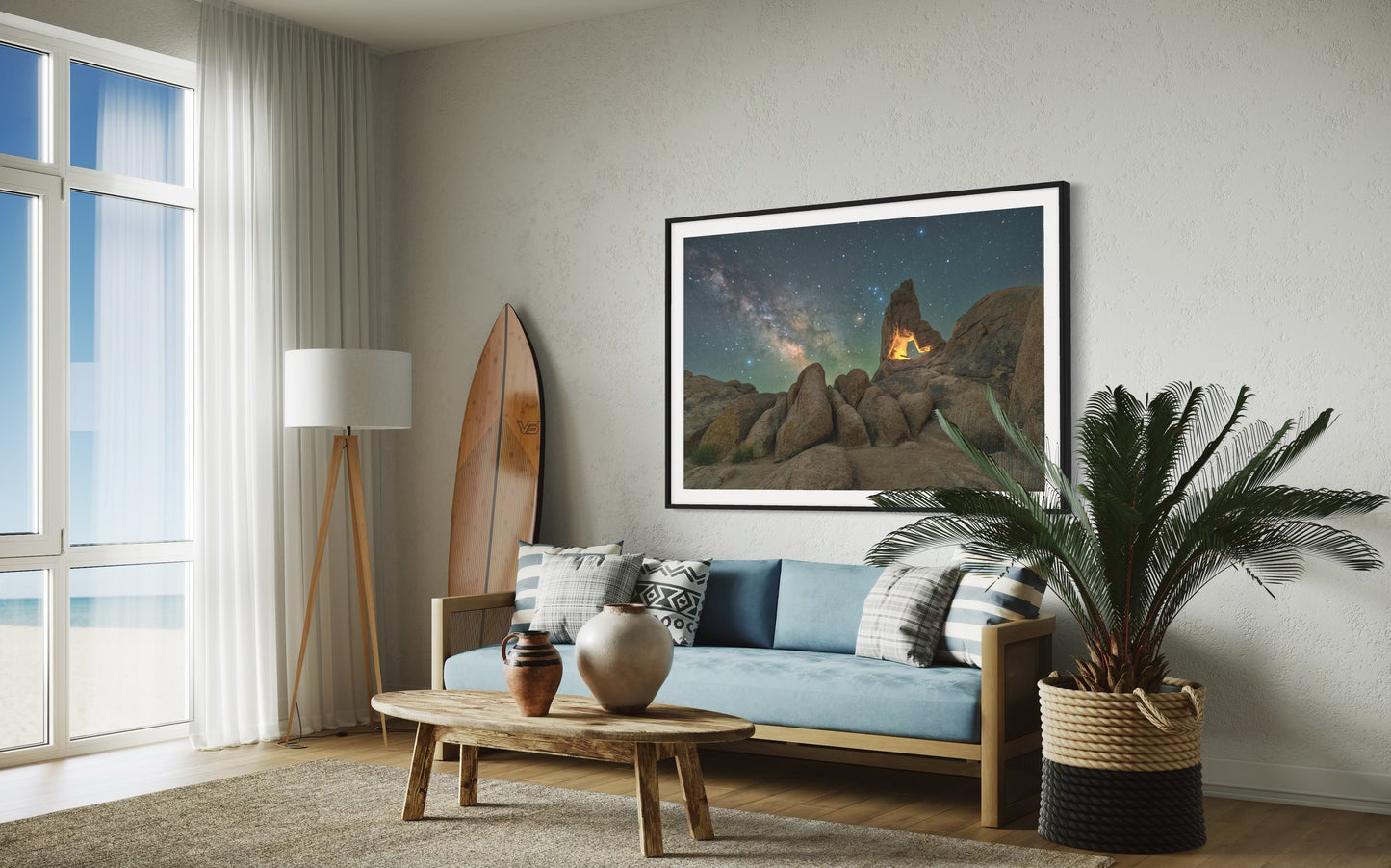 Stone and Stardust. A rock arch with milky way framed photo print hanging above the sofa in a living room.